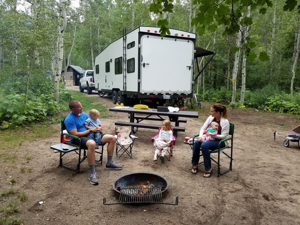 Family RVing in forest